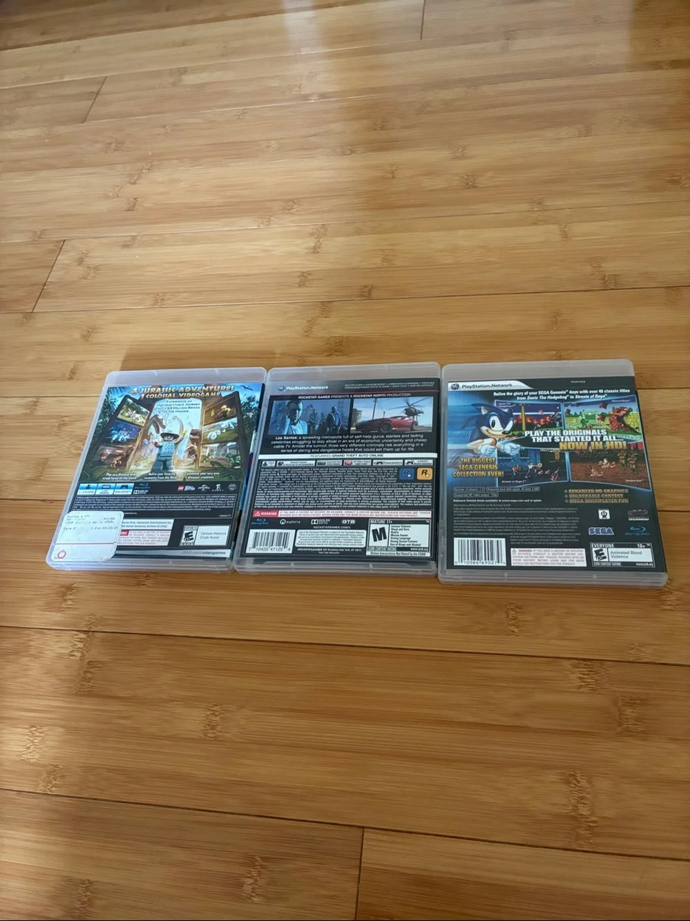 PS3 Thee Game Lot  GTA 5, Lego, Jurassic World, and sonic ultimate Genesis